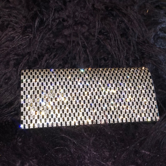 Handbags - Silver and black clutch purse.